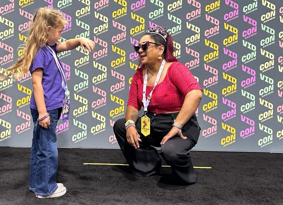 Child holds her hand out to Pinky Patel